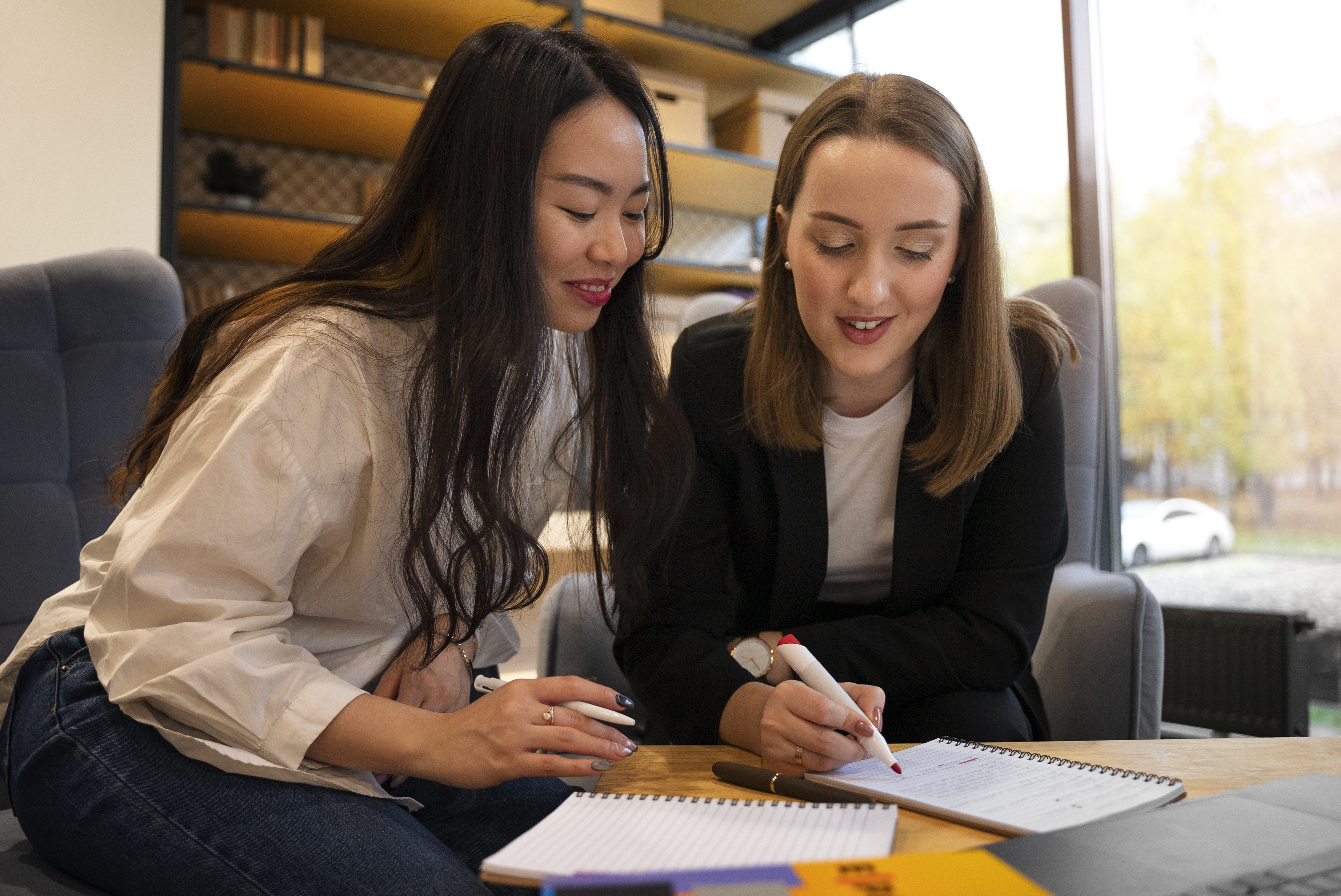 Educational advisor helping a student with written work